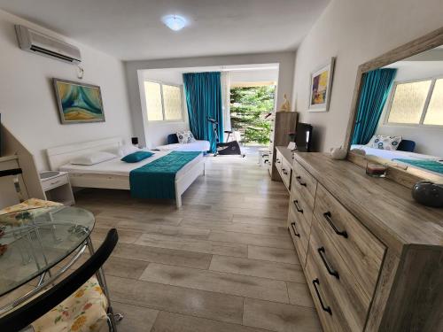 a large room with two beds and a window at Egon Apartments in Budva
