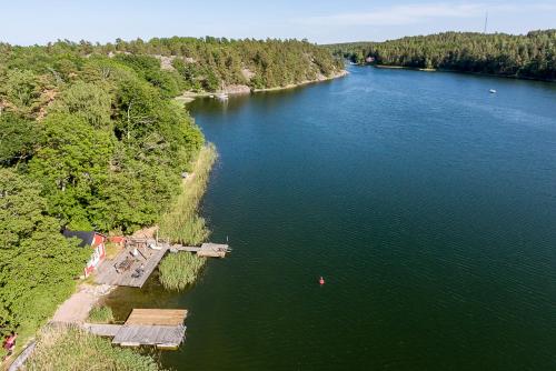 an aerial view of a river with trees and water at Villa Myttinge in Värmdö