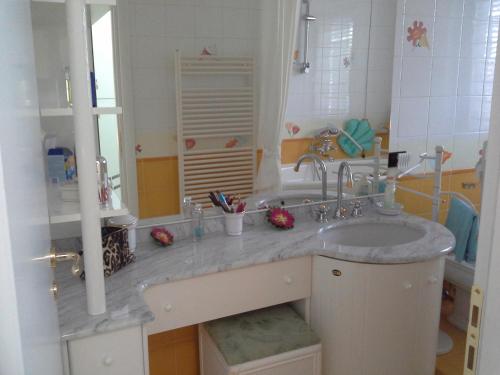 a bathroom with a sink and a mirror at Alba B&B in Isernia