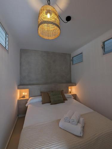 Katil atau katil-katil dalam bilik di Hostal Es Niu de Tamariu