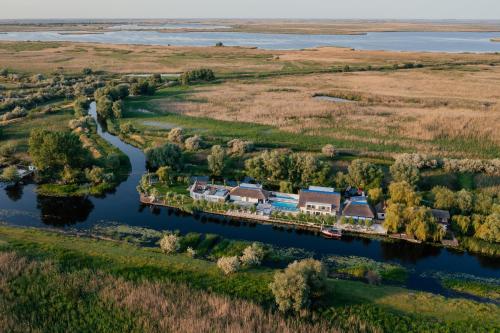 an aerial view of a house on a dock on a river at WPO - WILD PIKE OASIS in Caraorman