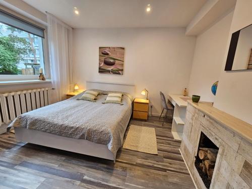 Postel nebo postele na pokoji v ubytování Apartament Flaming