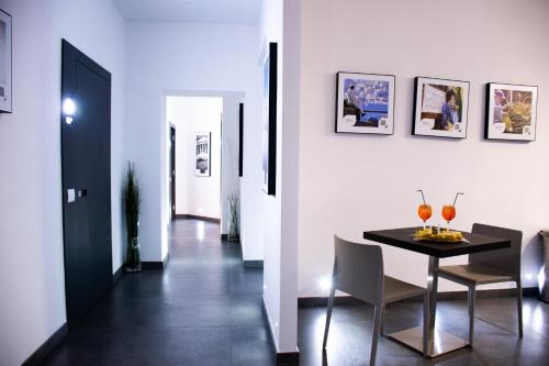 a dining room with a table and chairs at Megaris Luxury Suite Rooms in Naples