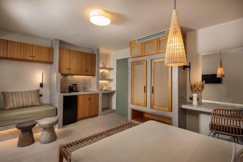 a kitchen and living room with a dining room at "Makava Suites" Your Luxe Urban Sanctuary in Naxos Chora