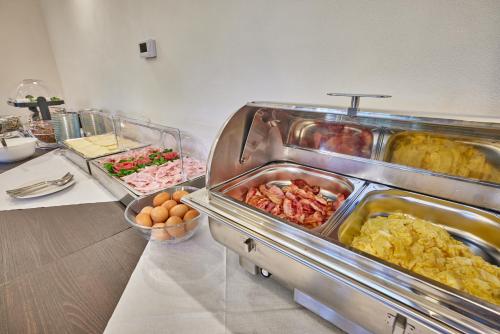 a buffet line with many different types of food at Hotel Auri in Rudník