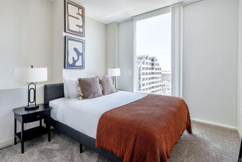 a bedroom with a bed and a large window at San Jose 1br w gym pool wd nr San Pedro Sq SFO-1312 in San Jose