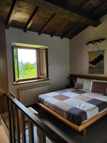 A bed or beds in a room at Appartamenti il Balzone