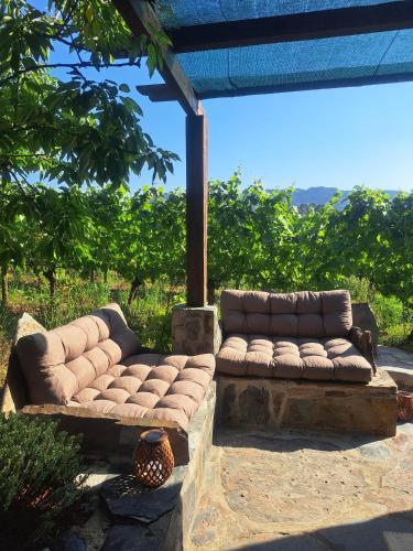 a couch sitting on top of a stone patio at Casa da Tileira in Penacova