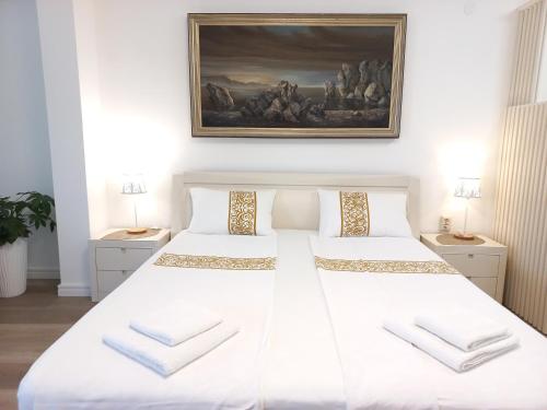 Postel nebo postele na pokoji v ubytování Egon Apartments