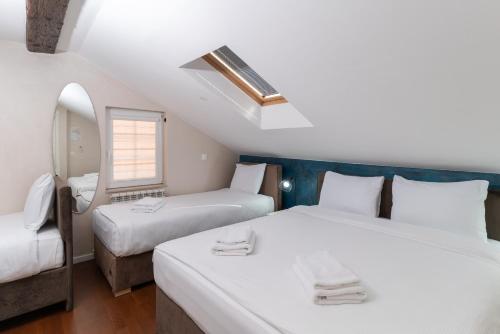 Postel nebo postele na pokoji v ubytování Ornament Hotel