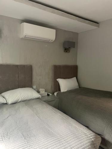 Postel nebo postele na pokoji v ubytování Park Avenue Hotel