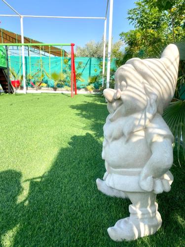 a statue of a bunny standing in the grass at Luxury Farm with Swimming Pool and BBQ in Al Rahba