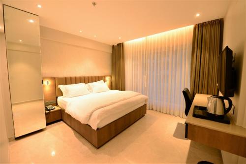 Postel nebo postele na pokoji v ubytování HOTEL ANUPAM RESIDENCY
