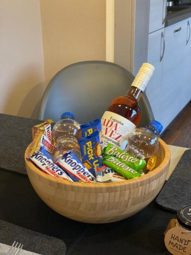 a bowl of snacks and a bottle of beer at Harzstübl25 in Sankt Andreasberg