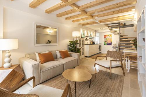 a living room with a couch and a table at Cascais Petit Bijou by CadenzaLux in Cascais