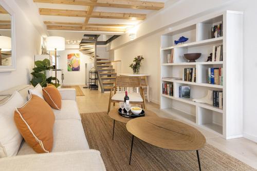 a living room with a couch and a table at Cascais Petit Bijou by CadenzaLux in Cascais