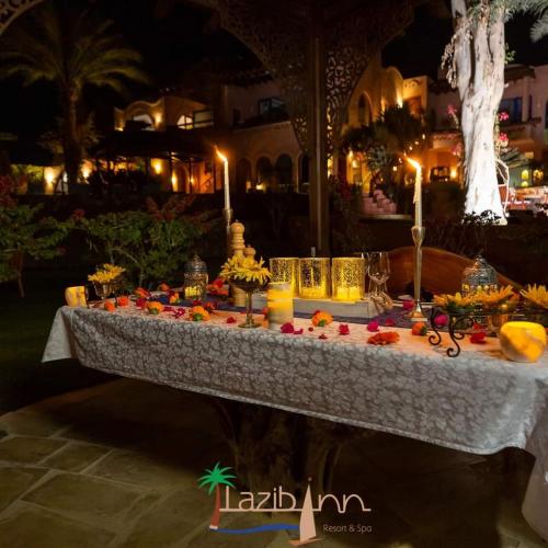 a table with food and candles on top of it at Lazib Inn Resort & Spa in Tunis
