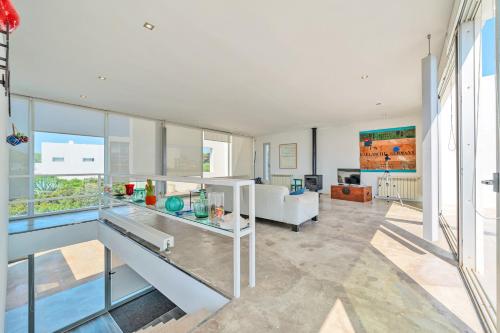 a living room with a couch and a table at Es Forti 52 in Santanyi