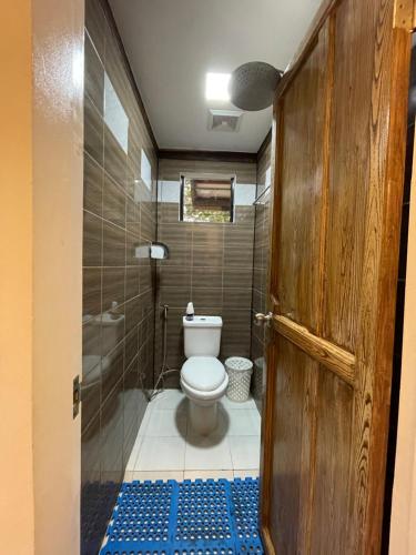 a bathroom with a toilet and a shower at Tabique by the Sea in Asturias