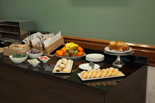 a buffet with different types of food on a table at Hotel Principe Paz in Santa Cruz de Tenerife