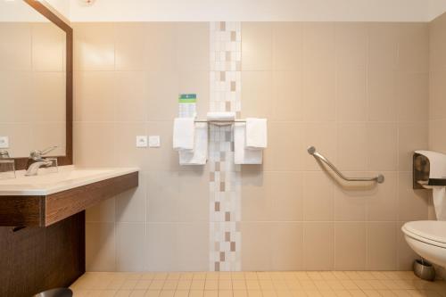 a bathroom with a sink and a toilet at Hotel De L'Agriculture - 2 étoiles in Saint-Hilaire-du-Harcouët