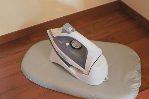 a hair dryer sitting on a pillow on the floor at 南のヴィラ前浜 ~PCH~ #MPC in Miyako Island