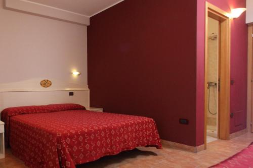 Postel nebo postele na pokoji v ubytování Hotel Campanello