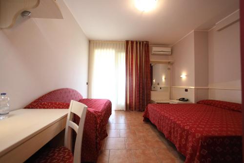 Postel nebo postele na pokoji v ubytování Hotel Campanello