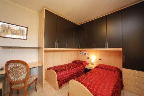 Postel nebo postele na pokoji v ubytování Hotel Campanello