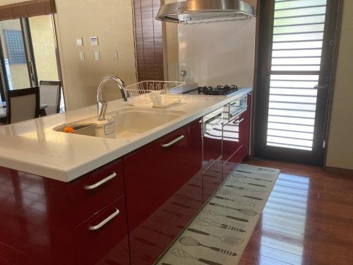 a kitchen with a sink and a counter top at YUFUIN YUKI-AN in Yufuin