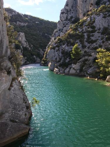 a river in a canyon with green water at studio meublé classé 2 étoiles - 30m² in Gréoux-les-Bains