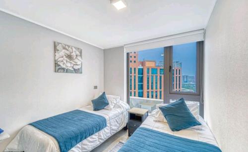 Postel nebo postele na pokoji v ubytování Alojamiento familiar con hermosa vista al mar