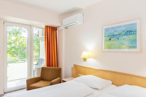 Katil atau katil-katil dalam bilik di Parkhotel Frankfurt Airport