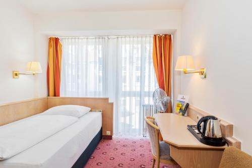 Katil atau katil-katil dalam bilik di Parkhotel Frankfurt Airport
