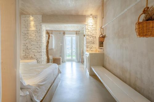 Postel nebo postele na pokoji v ubytování Levantes Ios Boutique Hotel
