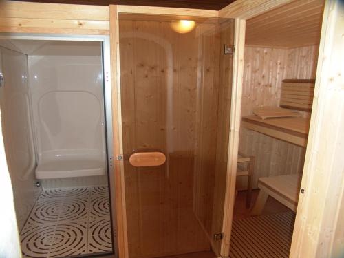 a small bathroom with a shower and a toilet at Private Hôtel - Adults Only in Porto-Vecchio