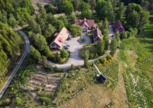 an aerial view of a house with a driveway at Escape to PaulssonPaleo in Simlångsdalen