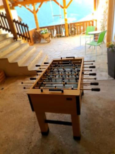 a pool table sitting in the middle of a patio at WASCHERHOF - Ferienwohnungen Oberhofer in Martello