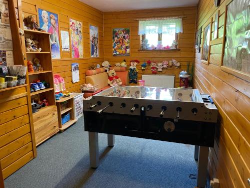 a toy room with a large tub in the middle of it at Penzion pod Tatrami in Ždiar