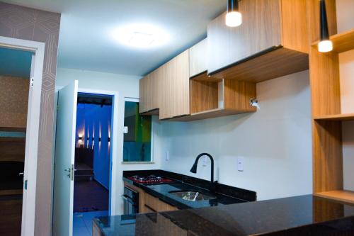 a kitchen with a sink and a counter top at Casa em Barreirinhas - Prime - Lençois Maranhenses - Temporada in Barreirinhas