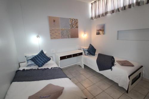 Ένα ή περισσότερα κρεβάτια σε δωμάτιο στο Seagull 511