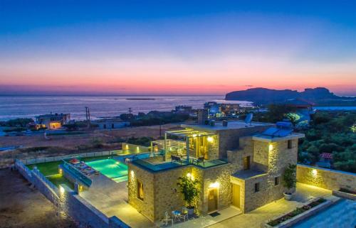 an aerial view of a house with a swimming pool at Villa Kore Luxuryvillaschania in Falasarna