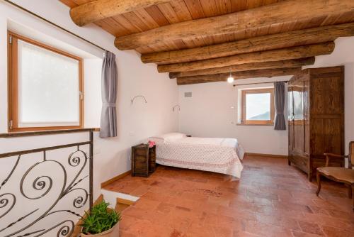 Ένα ή περισσότερα κρεβάτια σε δωμάτιο στο LA TORRE DEL MANGHEN: Agri-alloggio indipendente