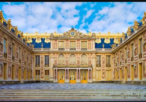 a large building with stairs in front of it at HOME VERSAILLES in Versailles