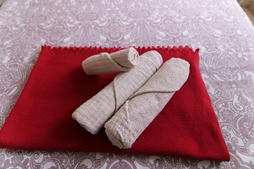 a pair of mittens sitting on top of a red napkin at Nomad Villa Santa Fe in Las Palmas de Gran Canaria