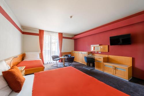 TV a/nebo společenská místnost v ubytování Jan Maria Hotel