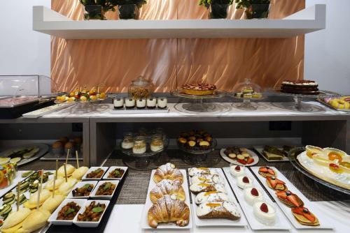a buffet line with many different types of food at Best Western Hotel Principe di Lampedusa in Palermo