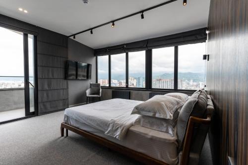 Postel nebo postele na pokoji v ubytování Gumbati Apart Hotel
