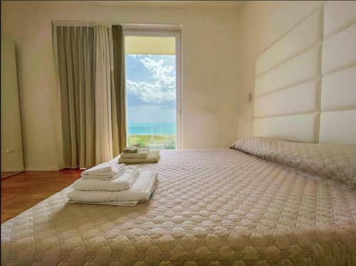 מיטה או מיטות בחדר ב-Hotel Artemide Mare