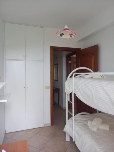 a bedroom with a bunk bed in a room at Dolce-Vista in Isnello